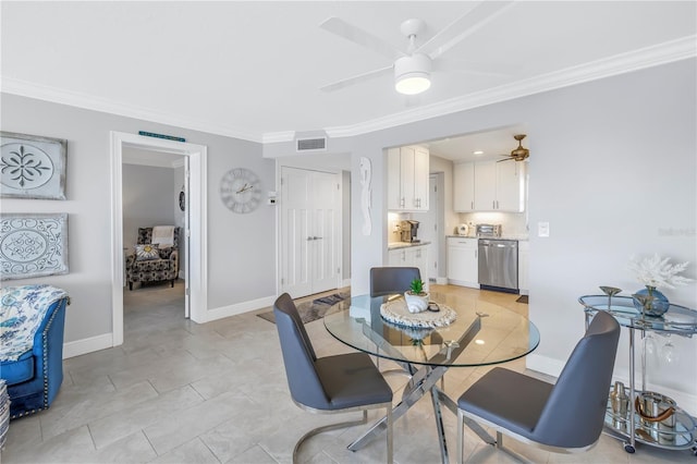 dining space featuring ceiling fan and crown molding