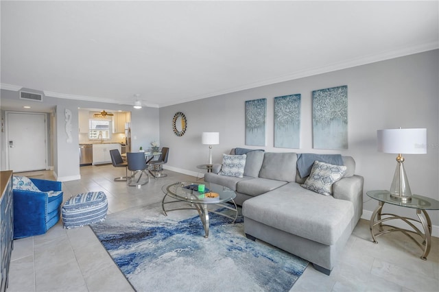 living room with ceiling fan and crown molding