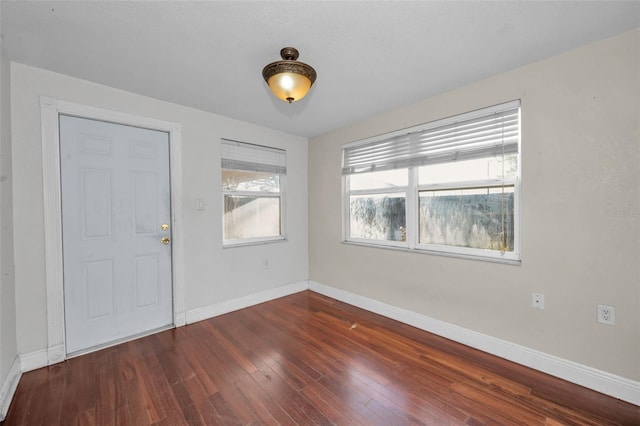 foyer entrance with dark hardwood / wood-style floors