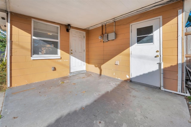 property entrance with a patio area