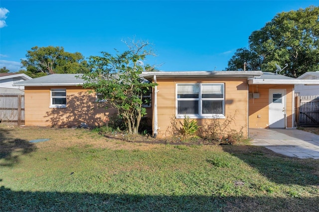 view of property exterior with a lawn