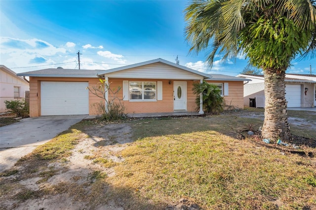 single story home with a front yard and a garage