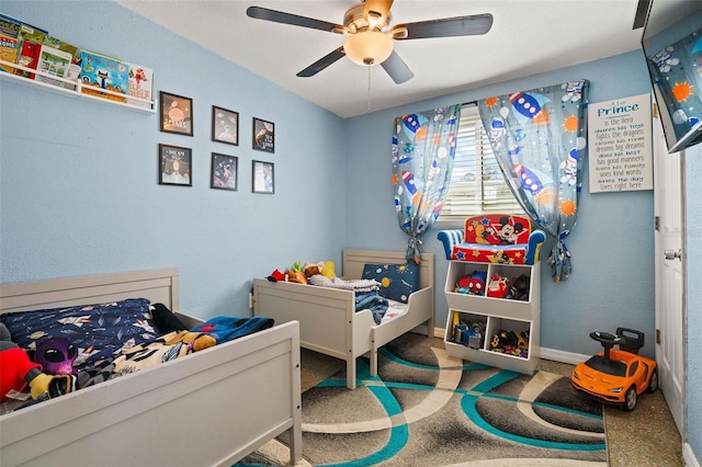 carpeted bedroom with ceiling fan