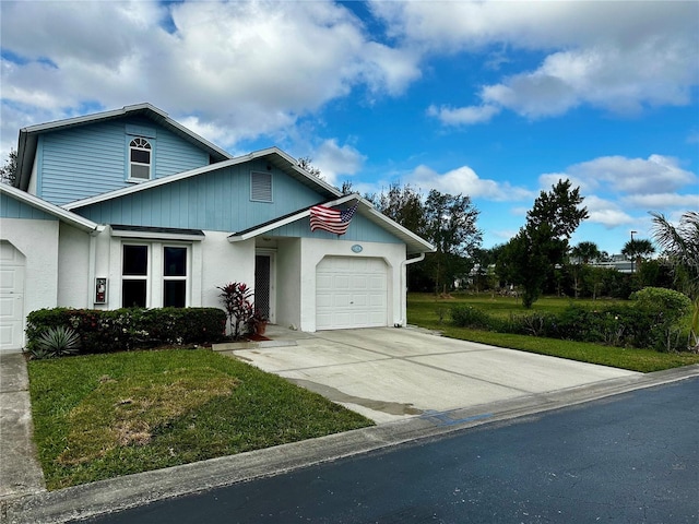 view of front of home with a garage and a front yard