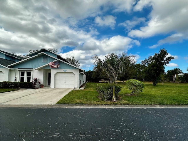 view of front of property featuring a garage and a front lawn