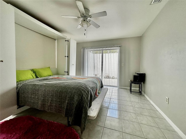 tiled bedroom with ceiling fan