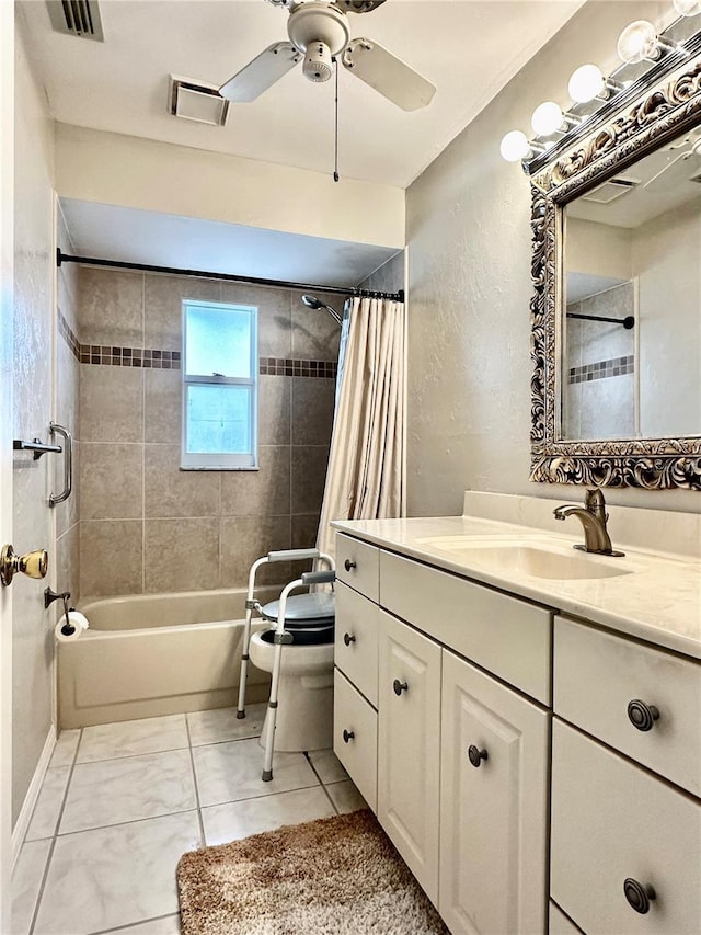 bathroom with ceiling fan, tile patterned flooring, vanity, and shower / bath combo