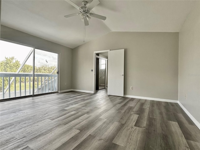 unfurnished room featuring dark hardwood / wood-style floors, ceiling fan, and lofted ceiling