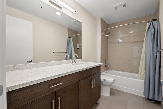 full bathroom featuring toilet, shower / tub combo, vanity, and tile patterned floors