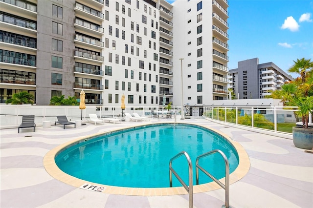 view of swimming pool with a patio area