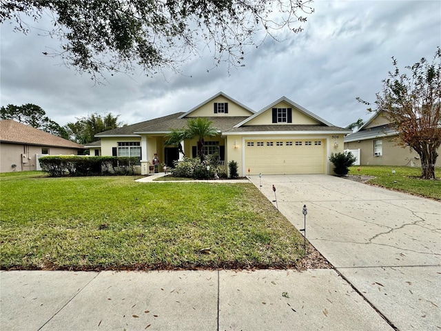 view of front of home featuring a garage and a front lawn