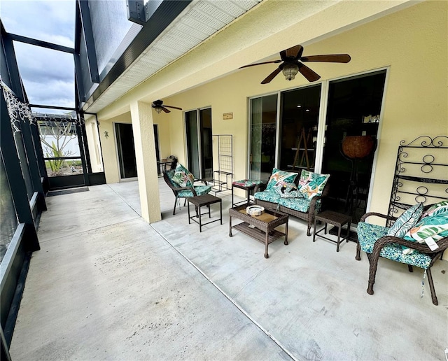 view of patio with a lanai and ceiling fan