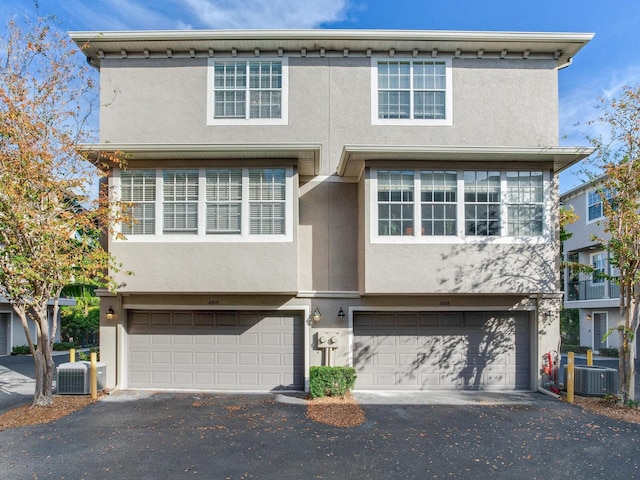 multi unit property with central AC unit and a garage