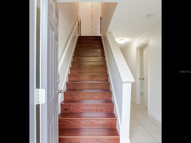 stairway featuring hardwood / wood-style floors