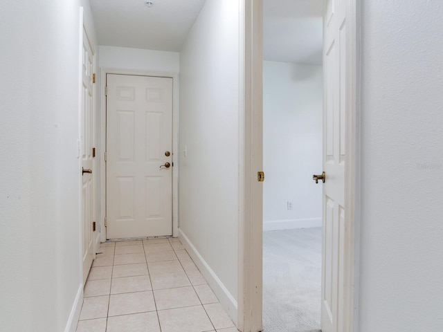 hallway with light tile patterned floors