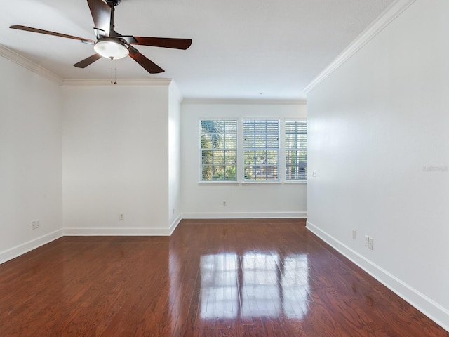 empty room with crown molding, ceiling fan, and dark hardwood / wood-style floors