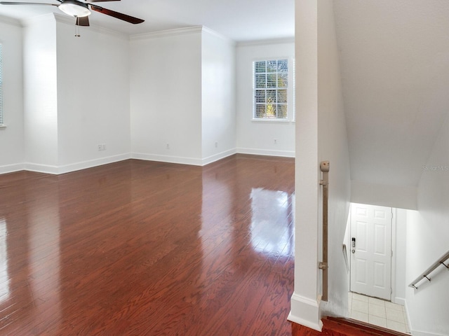 unfurnished room featuring hardwood / wood-style flooring, ceiling fan, and ornamental molding