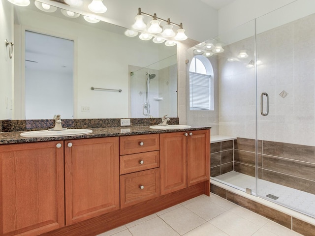 bathroom with vanity, tile patterned floors, and an enclosed shower