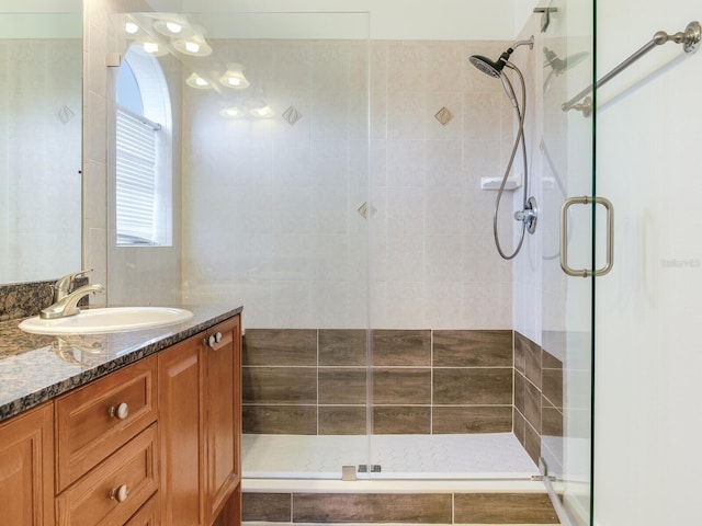 bathroom with vanity and walk in shower