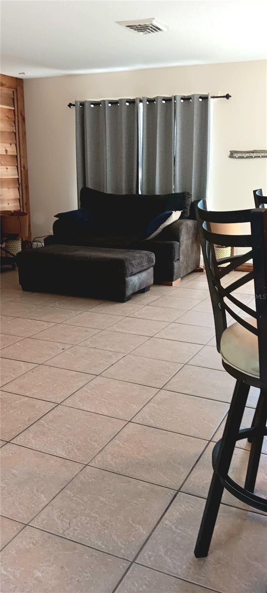 living room with light tile patterned floors