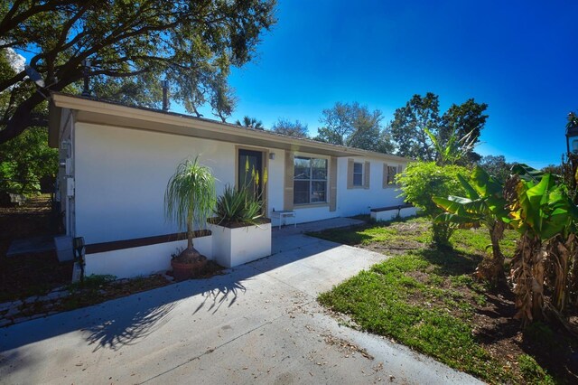 ranch-style house with stucco siding