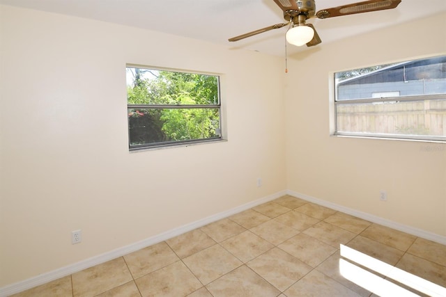 9567 85th St, Seminole, FL 33777 - unfurnished room featuring baseboards, tile patterned flooring, and ceiling fan