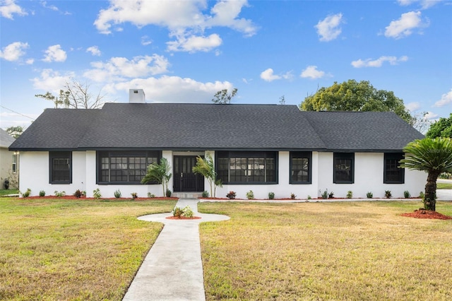 view of front of home with a front lawn