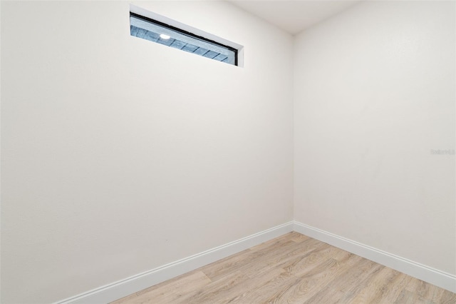 unfurnished room featuring hardwood / wood-style floors