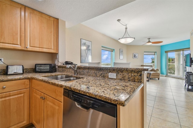 kitchen with dishwasher, sink, light tile patterned floors, a textured ceiling, and kitchen peninsula