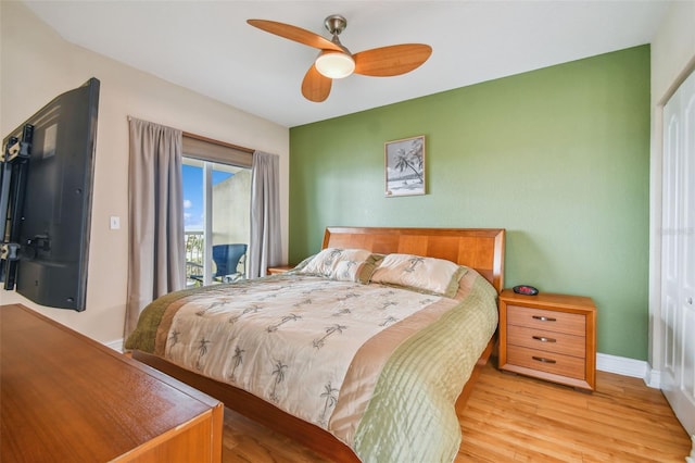 bedroom with access to outside, ceiling fan, and light hardwood / wood-style flooring