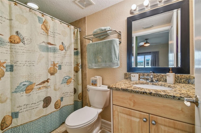 bathroom featuring ceiling fan, a textured ceiling, toilet, vanity, and a shower with shower curtain