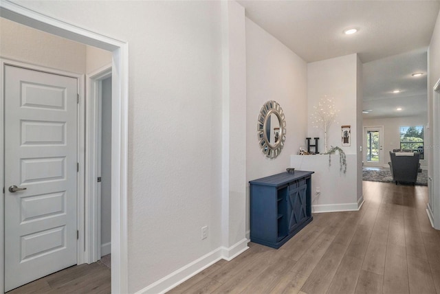 hall with light hardwood / wood-style flooring