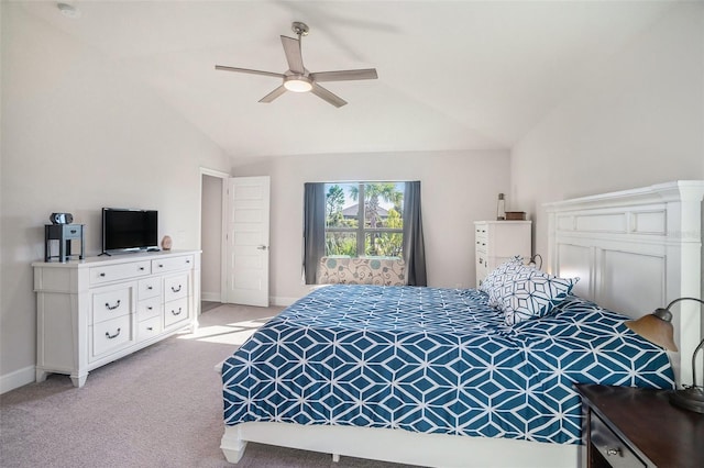 bedroom with light colored carpet, ceiling fan, and lofted ceiling