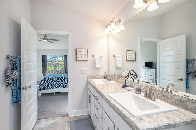 bathroom featuring tile patterned flooring, ceiling fan, and vanity