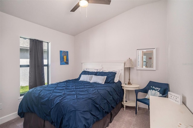 bedroom with ceiling fan, carpet floors, and lofted ceiling