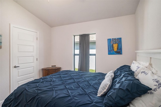 bedroom with lofted ceiling