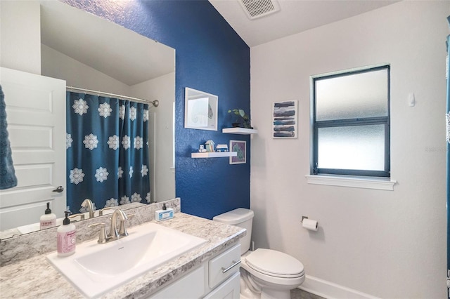 bathroom featuring a shower with shower curtain, vanity, toilet, and lofted ceiling