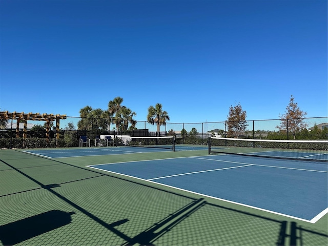 view of tennis court featuring basketball court