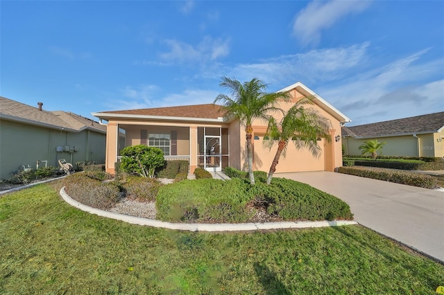 view of front facade with a front lawn and a garage