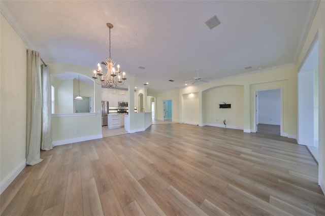 unfurnished living room with ceiling fan with notable chandelier, light wood-type flooring, and ornamental molding