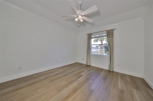 empty room with ceiling fan, light wood-type flooring, and ornamental molding