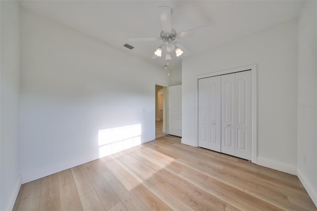 unfurnished bedroom with a closet, ceiling fan, and light hardwood / wood-style floors