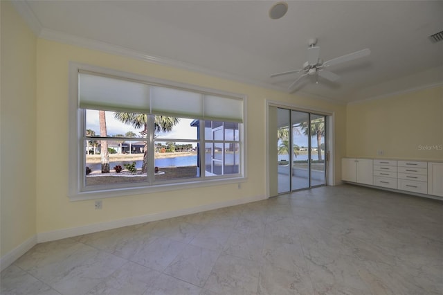 empty room with a water view, ceiling fan, and ornamental molding