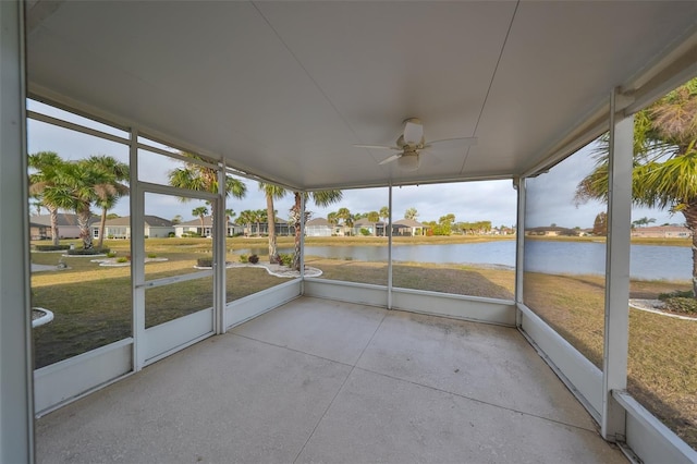 unfurnished sunroom featuring a water view and a wealth of natural light