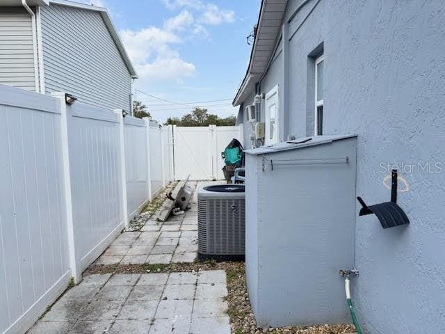 exterior space featuring a patio and central AC unit