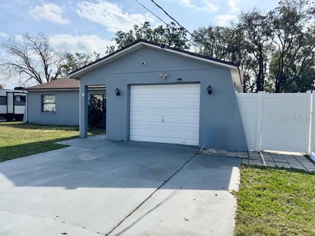 garage with a yard