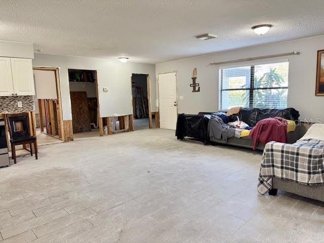 living room with a textured ceiling