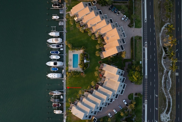 birds eye view of property with a water view