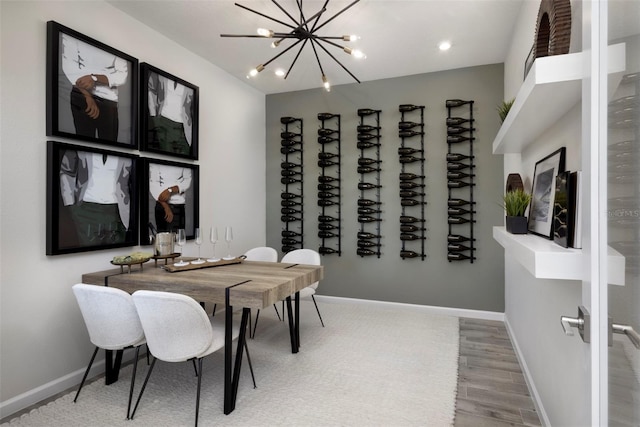 dining area with a chandelier and hardwood / wood-style flooring