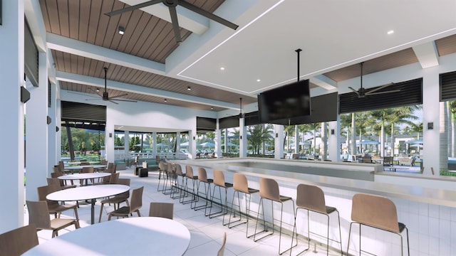 interior space featuring beamed ceiling, light tile patterned floors, ceiling fan, and wooden ceiling